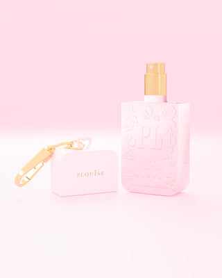 Pink hand spray bottle and case with 'P.Louise' branding on a pink background
