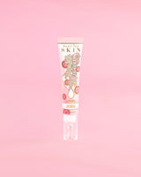Tube of P. Louise Dose Of Dreams C vitaminos Brightening Eye Cream rózsaszín alapon